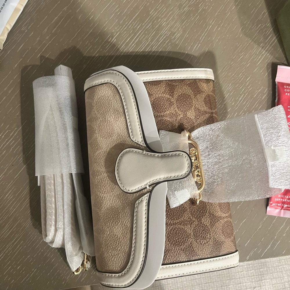 Coach Tan and Cream Clutch with Monogram Pattern